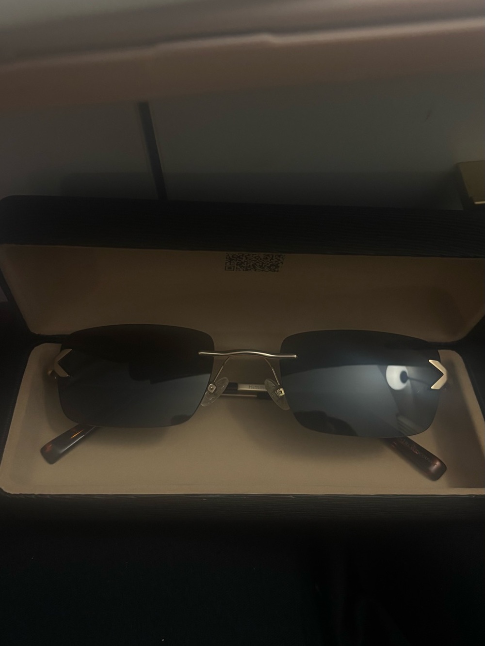 Rimless Black Lens Sunglasses with Gold Accents